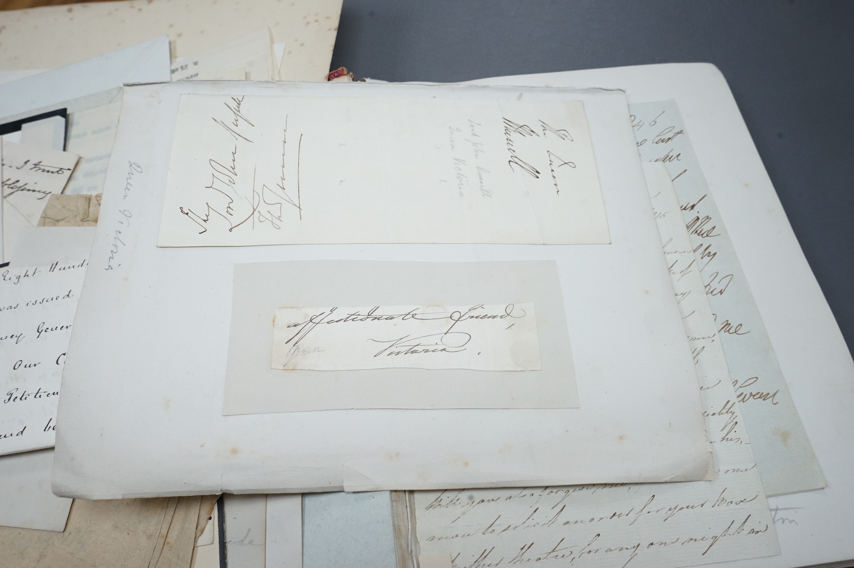 A Victorian autograph book containing a collection of complete letters, partial letters and cut out signatures from leading and influential figures primarily from the second half of the nineteenth century, many of the ex